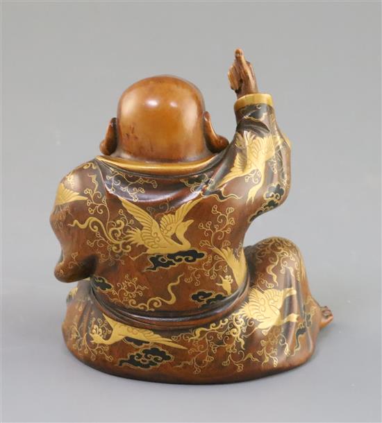 A Japanese wood and gilt lacquer figure of Hotei, Meiji period, H. 11.3cm, two toes lacking